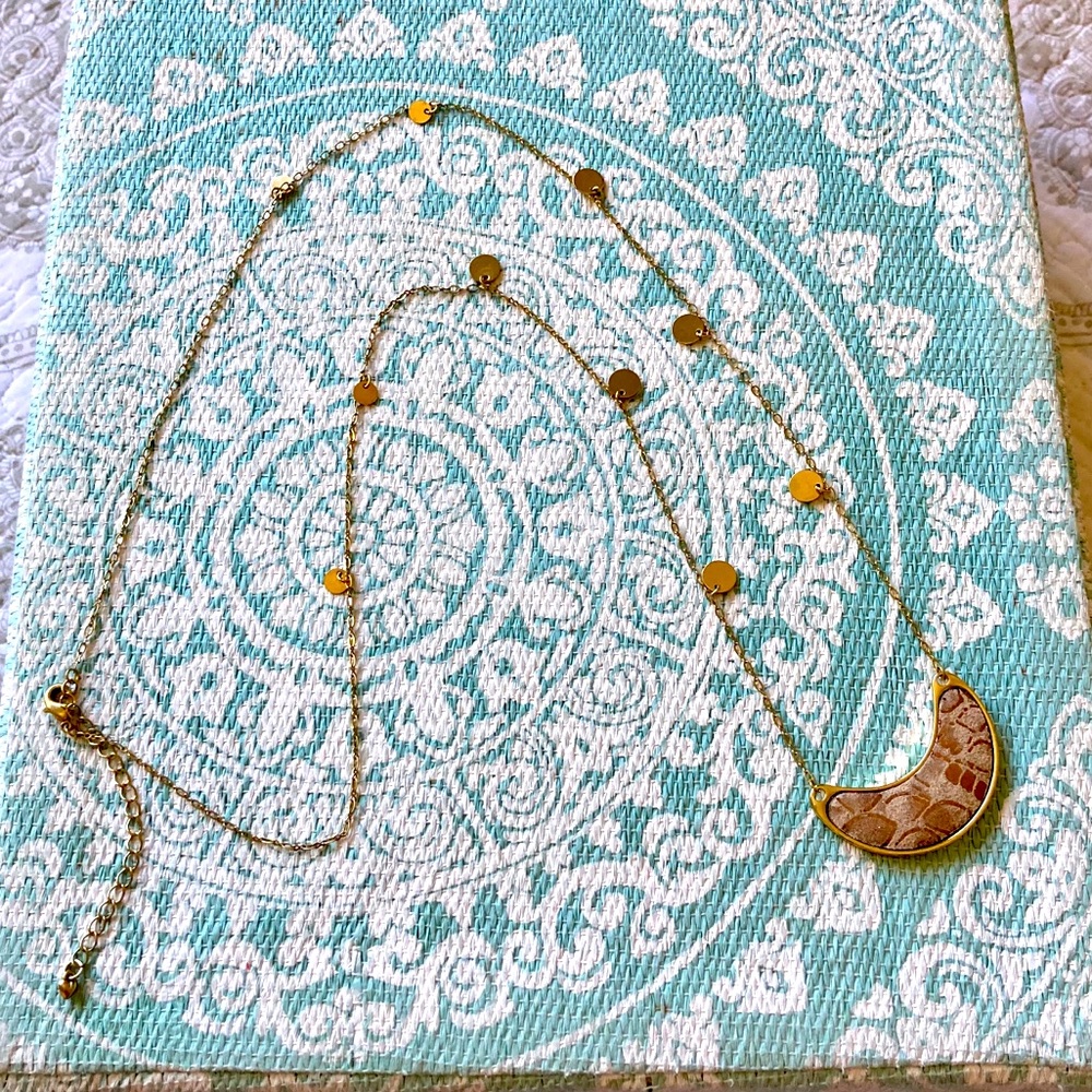 Snakeskin crescent pendant